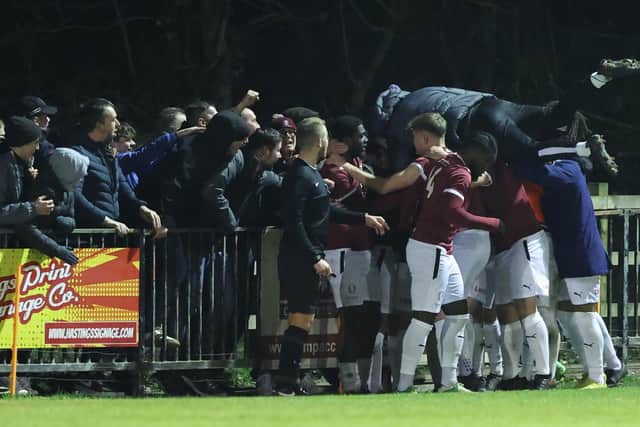 Hastings players and fans celebrate after Craig Stone's late goal puts them 2-1 up v Folkestone | Picture: Scott White