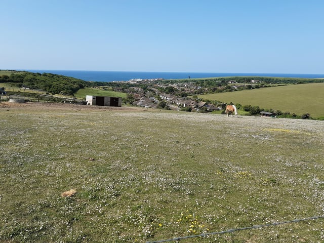 As you climb, do pause to take a look back at the view over to Beacon Mill and the sea.