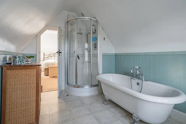 The en-suite bath and shower room