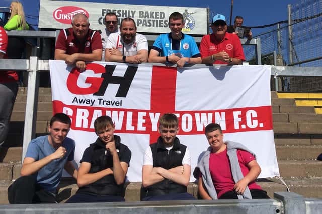 Crawley Town fans with the GH Away Travel flag