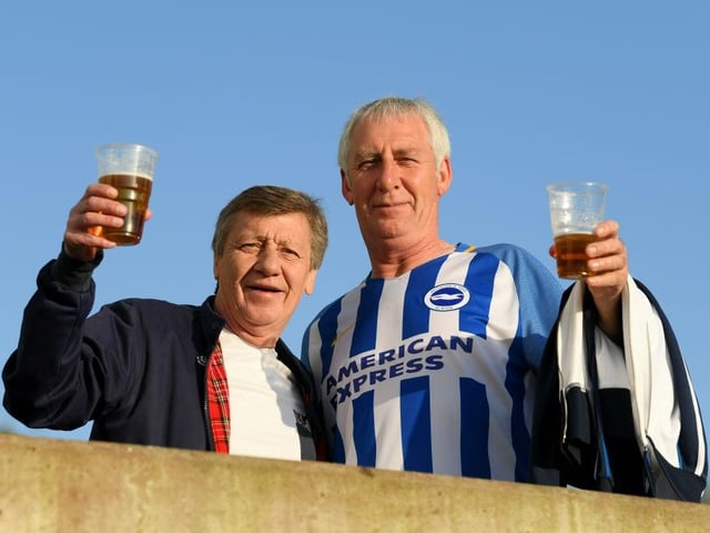 Fans arrive at the stadium for the Premier League match between Brighton and Hove Albion and Manchester United at Amex Stadium on May 4, 2018.