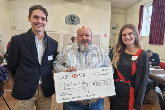 Simon and Sabrina from HSBC hand a cheque to Lindfield Repair Café