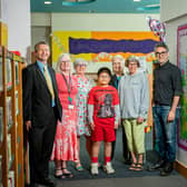 Councillor Duncan Crow, Cabinet Member for Community Support, Fire and Rescue; Gill Burch, Manager of Crawley Library; Carol Collins, Headteacher of Seymour Primary School in Broadfield; Adrian Hua aged (10) from Seymour Primary School in Broadfield who helped design the mural; Councillor Brenda Burgess; Louise Blackwell from Creative Crawley and Karl Singporewaka.