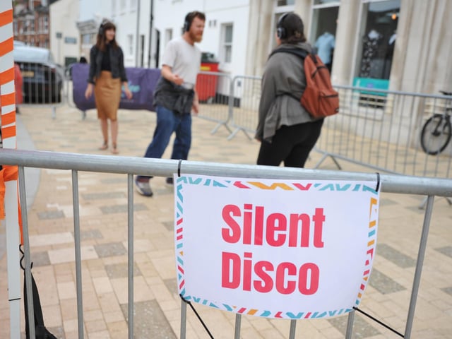 Dancing to music on headphones at the silent disco