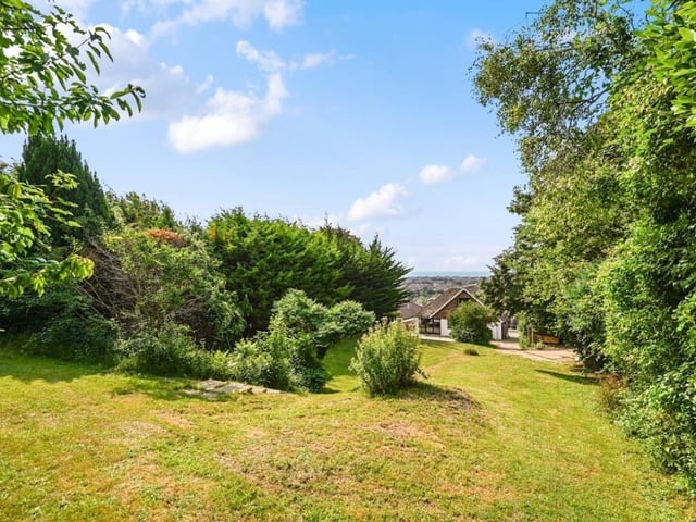 The property viewed from the expansive gardens