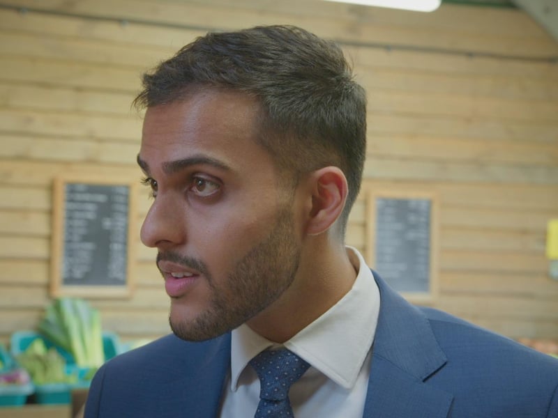 Avi negotiates for fresh asparagus with the seller at the farm shop, Fremantlemedia Limited,N/A