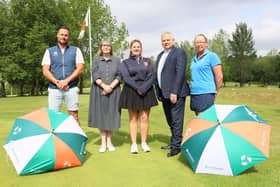 Megan Dawson, centre, with Cllr Anne_Marie Cooke left, and Martin Crick, Managing Director of Persimmon Homes South East right, and representatives of Lindfield Golf Club.
