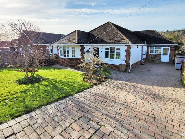 This detached bungalow in Maytree Avenue, Findon Valley, has four double bedrooms, a spacious lounge/kitchen/diner and parking for several vehicles. Offers over £600,000.