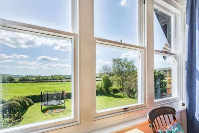 The property has panoramic views over the South Downs from the front