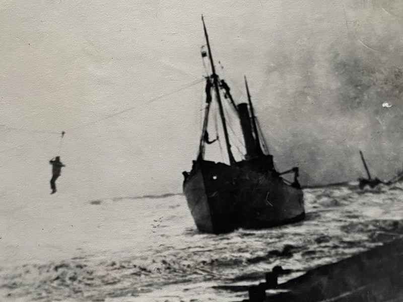 Landing crew of SS Game Cock in breeches buoy, 1 September 1908, attended by Newhaven’s ‘Michael Henry IV’.