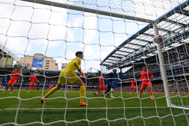 LONDON, ENGLAND - APRIL 15: Danny Welbeck of Brighton & Hove Albion equalises as Kepa Arrizabalaga of Chelsea is rooted to the spot during the Premier League match between Chelsea FC and Brighton & Hove Albion at Stamford Bridge on April 15, 2023 in London, England. (Photo by Mike Hewitt/Getty Images)