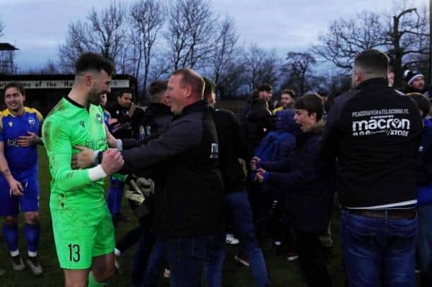 Keeper Nathan Stroomberg is congratulated as Peacehaven and Telsocmbe' celebrate at Harefield | Picture: Stanley Bernard for P&TFC