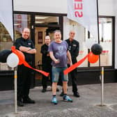 Pete Rich, the first customer at STS Tyre Pros, cuts the ribbon to open the new centre on London Rd 
