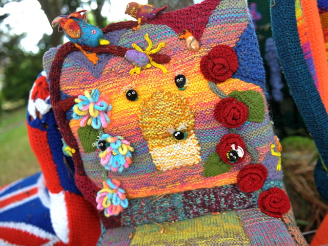 East Preston Yarnbombers have created an enchanting picnic area with chairs that are beautifully-decorated knitted masterpieces