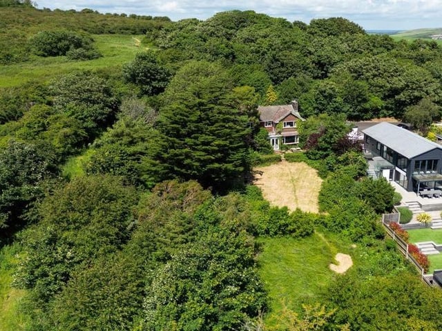 This substantial detached family house sits on the highest point in North Lancing, with grounds totalling 0.5 acres of land. Offers in the region of £1million are invited for this four-bedroom property at the foot of the South Downs National Park, with magnificent panoramic coastal views.