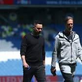 Roberto De Zerbi, Manager of Brighton & Hove Albion (C), and Andrea Maldera, Assistant Manager of Brighton & Hove Albion (R), inspect the pitch prior to the Premier League match against Manchester United