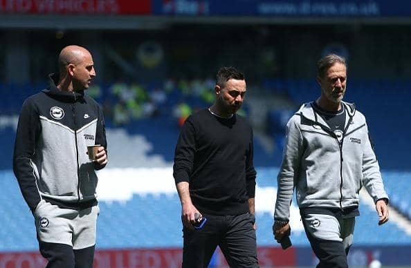 Roberto De Zerbi, Manager of Brighton & Hove Albion (C), and Andrea Maldera, Assistant Manager of Brighton & Hove Albion (R), inspect the pitch prior to the Premier League match against Manchester United