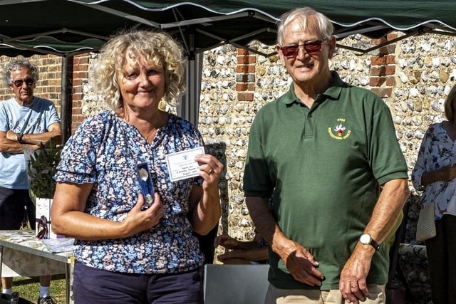 Sarah Hill receives the British Fuchsia Society Silver Spoon from Colin Crane at East Preston and Kingston Horticultural Society flower show