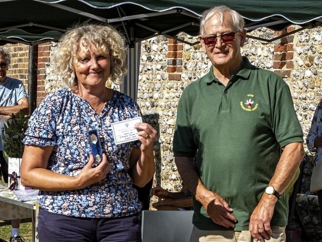 Sarah Hill receives the British Fuchsia Society Silver Spoon from Colin Crane at East Preston and Kingston Horticultural Society flower show