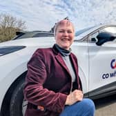 Cllr O'Brien pictured with a Co-wheels car
