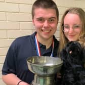 Winners Olivia Kidd and Jack Bristow with their trophy and mascot 'Nigel the Newfie’