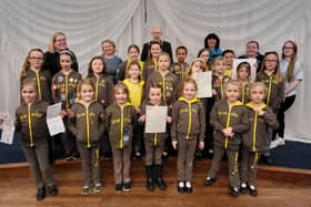 Arundel Brownies, with their leaders, town clerk Carolyn Baynes, mayor Tony Hunt and town event manager Tracy Clayton, showing posters they designed by for their Easter appeal