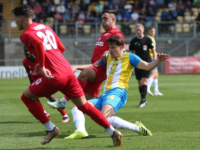 Action from Worthing's 3-0 win at Torquay United which put them top of National League South
