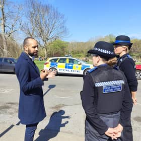 Eastbourne MP Josh Babarinde speaking with two Police Community Support Officers. Photo: contributed