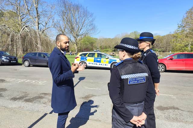 Eastbourne MP Josh Babarinde speaking with two Police Community Support Officers. Photo: contributed