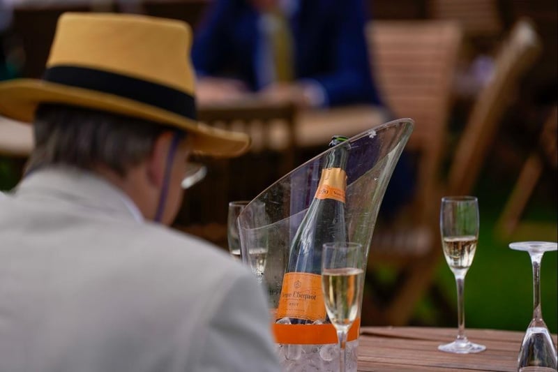 CHICHESTER, ENGLAND - AUGUST 03: Champagne on the lawn at Goodwood Racecourse on August 03, 2023 in Chichester, England. (Photo by Alan Crowhurst/Getty Images):Images from Ladies' Day, Glorious Goodwood 2023