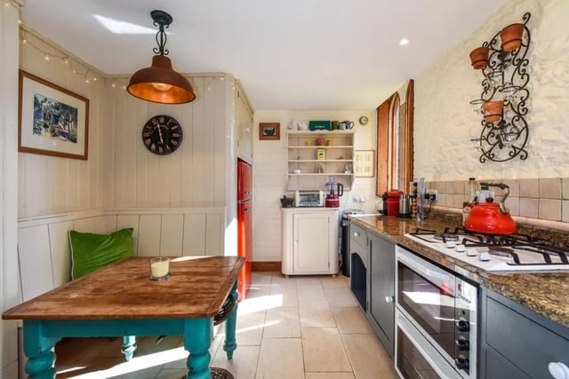 The  kitchen/breakfast room with a range of base units, butler sink, granite worktops, space and plumbing for dishwasher, double oven, gas hob, tiled flooring, part timber panelling with a built-in bench seat completes the ground floor accommodation. Picture: Zoopla