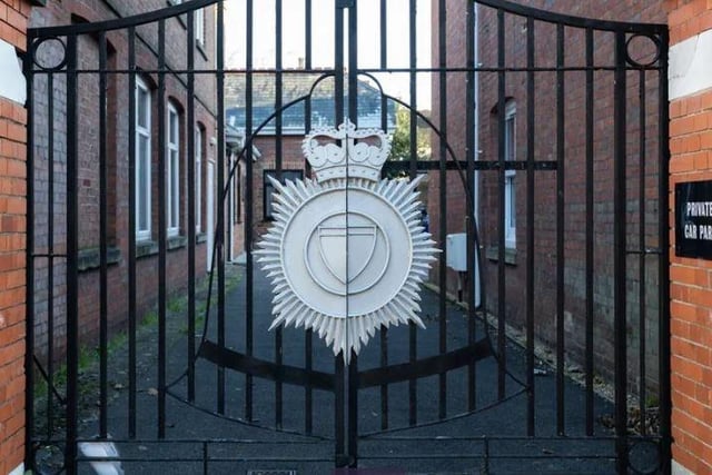 The gates to the flats still have a former Sussex Police badge