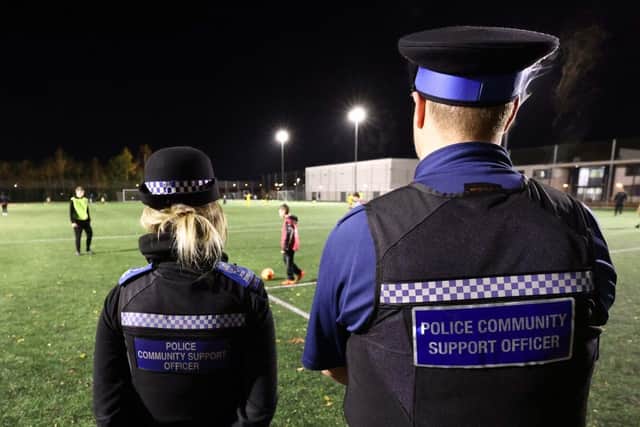 Two PCSOs watch on at a PL Kicks session in Crawley