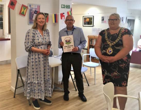 Dean Stewart, Isabel Blackman Centre Manager receives the ‘Carer Friendly’ award from Sally-Ann Hart MP for Hastings and Rye (left)  and Cllr Margi O' Callaghan, Mayor of Hastings (right)