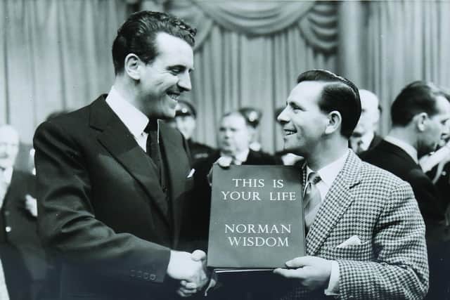 Norman Wisdom receiving his ‘This is Your Life’ book in 1957 which is being sold at Toovey’s in Sussex.
