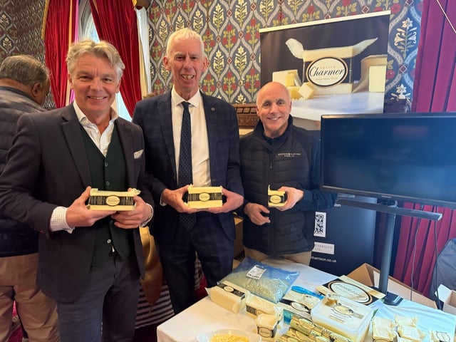 John Milne with Tim Harrison and Rob Bookham celebrating their Sussex Charmer cheese.