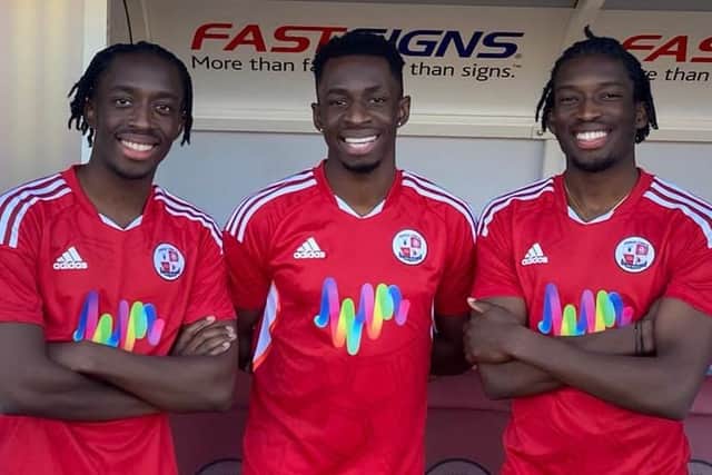 Tobi Brown with brothers Manny and Jed at Crawley Town