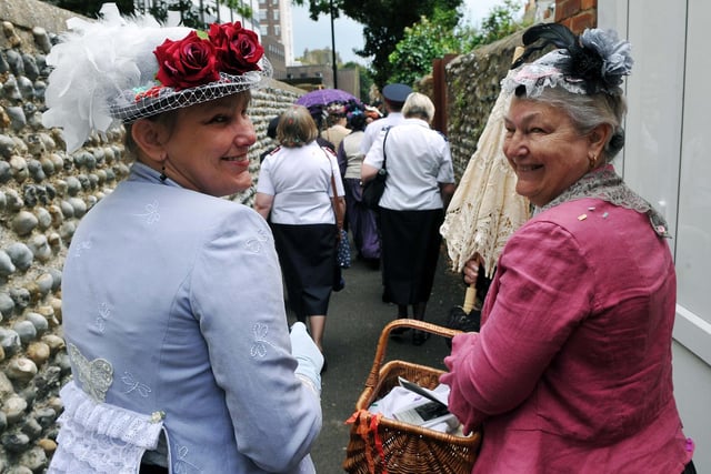Victorian women making their way down Field Row
