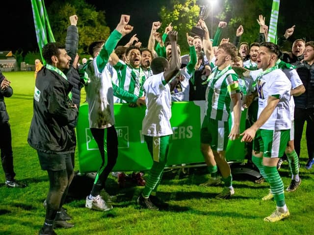 Chichester City with their play-off trophy after clinching promotion to step three | Picture: Neil Holmes