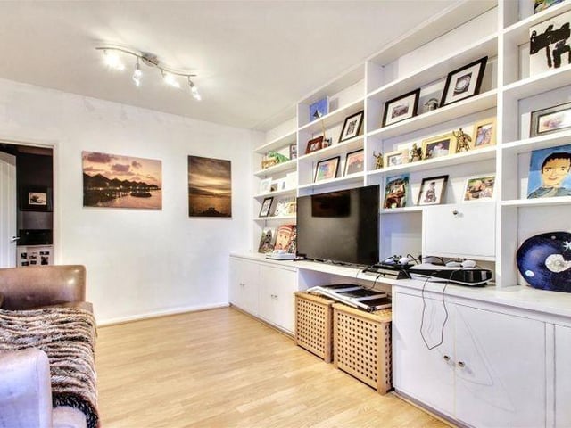 The versatile TV/playroom has garden access