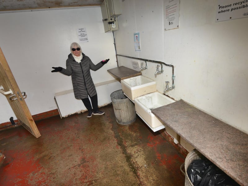 Beach hut tenants in West St Leonards are furious about the condition of their huts. Polly Brookes inside the toilet block.