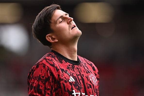 Manchester United's English defender Harry Maguire warms up ahead of the Premier League football match between Manchester United and Brighton and Hove Albion at Old Trafford