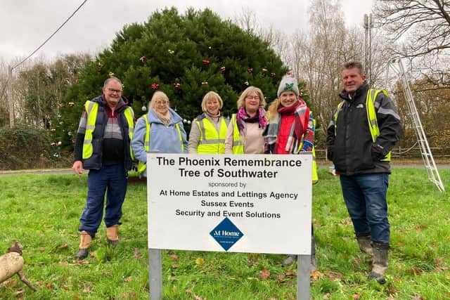 Southwater villagers, pictured earlier this month, after decorating  The Phoenix Tree in memory of lost loved ones