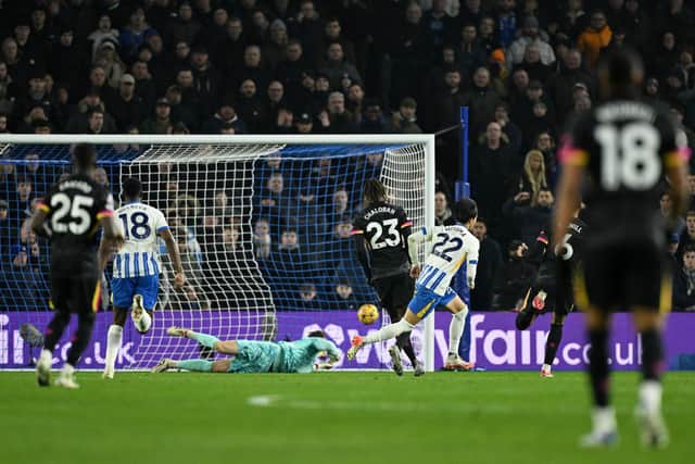 Kaoru Mitoma of Brighton & Hove Albion scores his team's first goal during the Premier League match against Chelsea