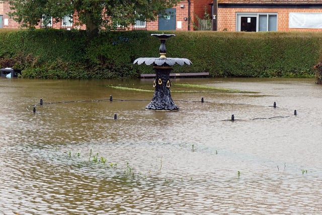 The fountain at Hall Leys Park in Matlock was almost submerged by flood waters this morning.