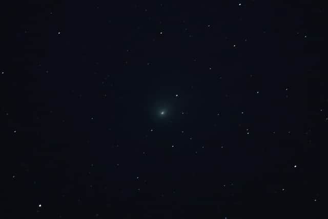 BAKER, CALIFORNIA - JANUARY 31: Comet C/2022 E3 (ZTF) is visible in the sky above the Mojave National Preserve in San Bernadino County as it approaches Earth for the first time in about 50,000 years on January 31, 2023 near Baker, California. The comet was discovered on March 2, 2022, and will be at its closest point to Earth on February 1, 2023. Its orbit extends far out into our solar system and has a green aura because it is passing close enough to the sun for the outgassing of its diatomic carbon molecules to react with the solar wind. (Photo by Ethan Miller/Getty Images)