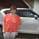 Vikki Climpson pictured with her car outside her home in Hastings.