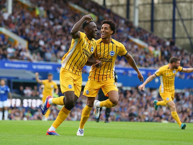 Danny Welbeck of Brighton & Hove Albion celebrates scoring his team's second goal at Everton with teammate Joao Pedro