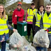 Volunteers pictured next to collected litter.