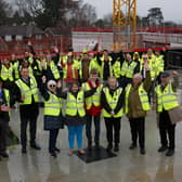 Woodlands Meed students, staff and governors with West Sussex County Councillors and ISG staff at the 'topping out' ceremony on February 22